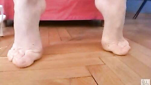 Gymnast nibbles on her toes!